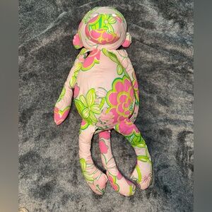 Lilly Pulitzer floral printed stuffed monkey.